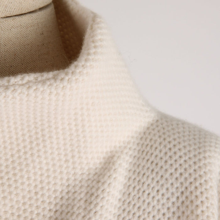 Close-up of a textured knitted jacket on a mannequin