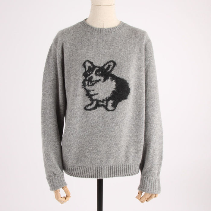 Gray sweater with a dog design on a mannequin against a white background