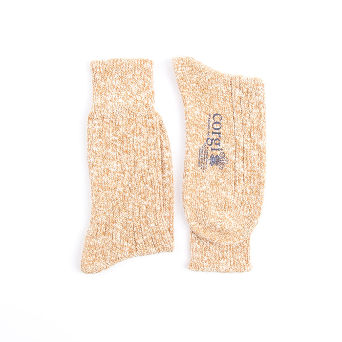 showing a pair of socks knitted in a yellow and white mix colour