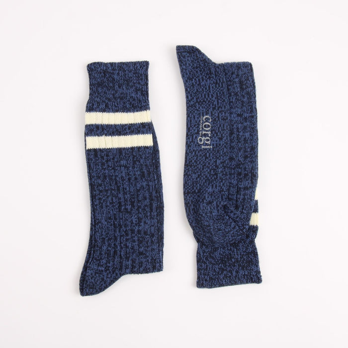 Pair of blue socks with white stripes on a white background