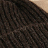 Close-up of a textured brown fabric surface