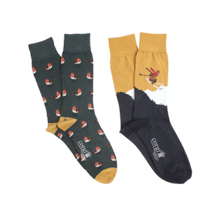 A pair of men's socks with a Christmas-themed design featuring a robin and a bear