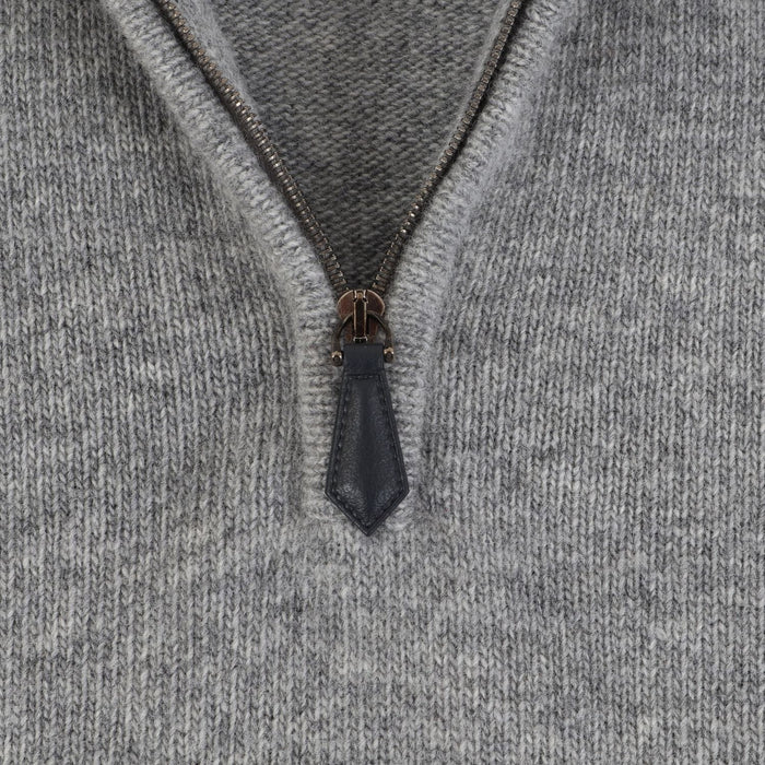 Close-up of a zipper on a gray fabric background