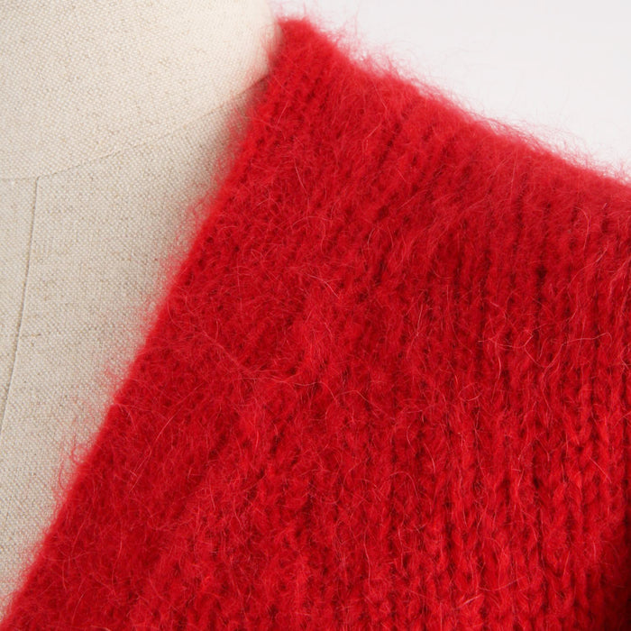 Close-up of a red textured fabric on a light background