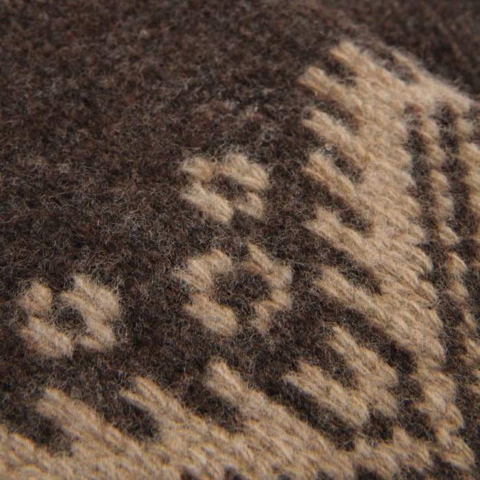 Close-up of a brown fabric with a geometric pattern