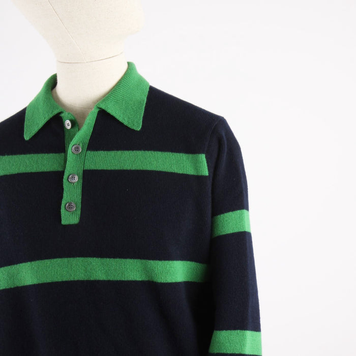 Navy blue and green striped sweater on a mannequin with a white background