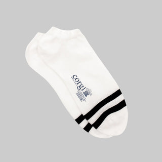 A pair of white trainer socks with black stripes on the toe.