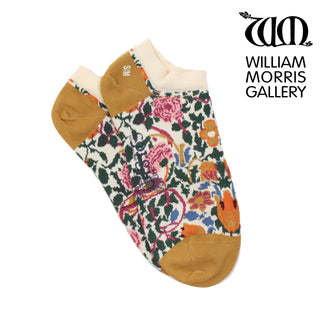 A pair of multicolored trainer socks with a floral pattern, featuring roses, and the William Morris Gallery logo at the top.
