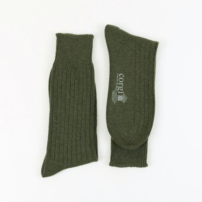 Pair of loden green cashmere ribbed socks on a white background