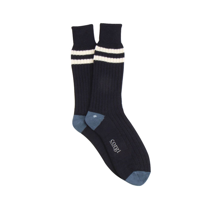 navy socks with white stripes and blue toes and heel photographed on a white background