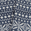 Close-up of a blue and white knitted fabric with a pattern