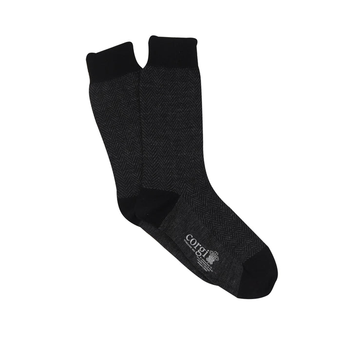 A pair of men's formal herringbone merino wool socks in black.
