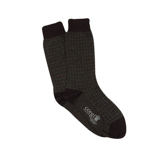 A pair of men's formal houndstooth merino wool socks in charcoal showing the pattern and texture.