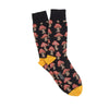 Navy socks with red mushroom pattern and yellow accents on a white background