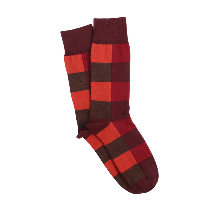 Red and brown checkered sock on a white background