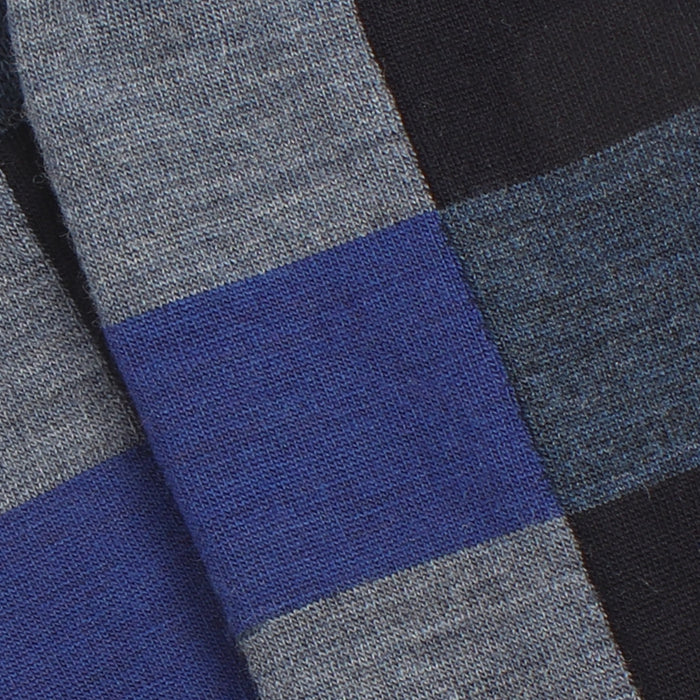 Close-up of striped fabric with blue, gray, and black colors.