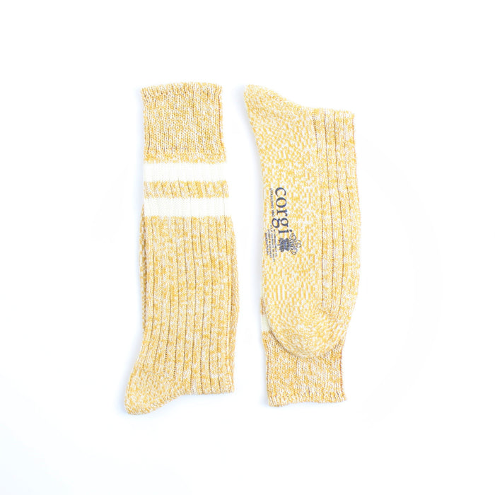 Yellow socks with a brand logo on a white background