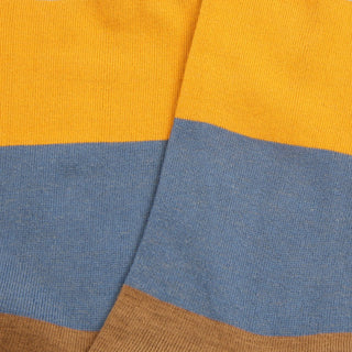 Close-up of striped fabric with yellow, blue, and brown colors.