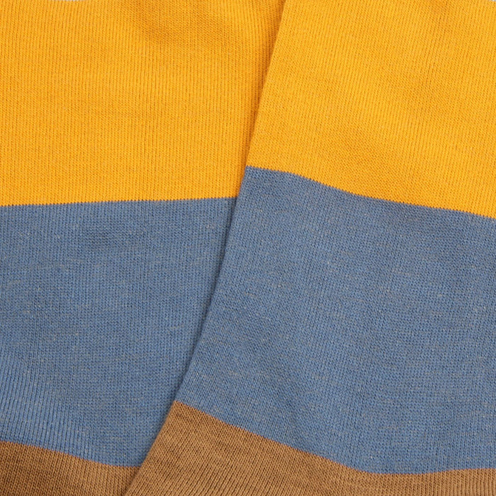 Close-up of striped fabric with yellow, blue, and brown colors.