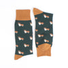 Pair of socks with corgi pattern and gold accents on a white background