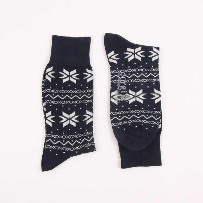 Two navy blue socks with white snowflake patterns on a white background