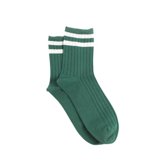 Green sock with white stripes on a white background