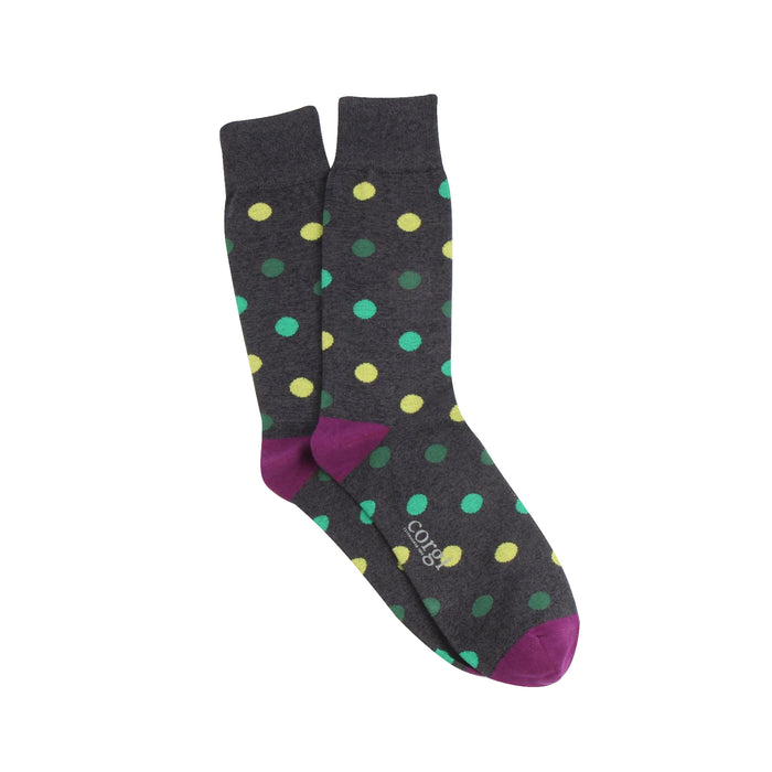 Charcoal socks with colourful polka dots on a white background
