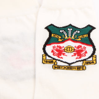 Knitted crest of Wrexham AFC on a white background