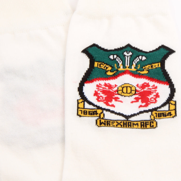 Embroidered crest on a white background