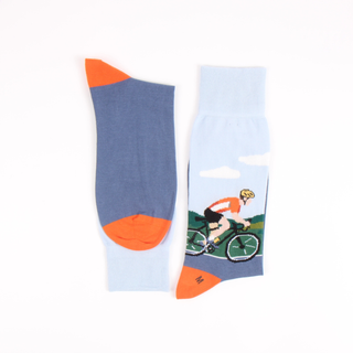 Blue and orange sock with a cyclist design on a white background