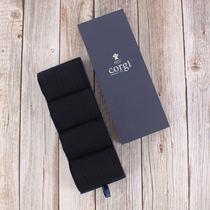 4 pairs of navy socks shown in a Corgi Gift box