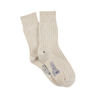 Pair of beige socks with a brand logo on a white background