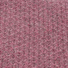close up of textured poncho  in pink