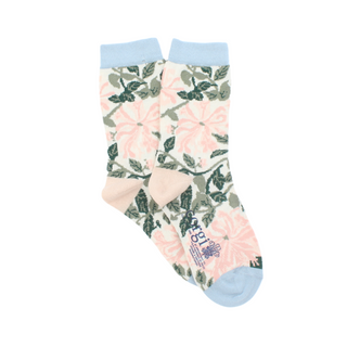 A pair of kids' socks with a William Morris Honeysuckle floral pattern in cream and pink colors, with a pale blue cuff, heel, and toe.