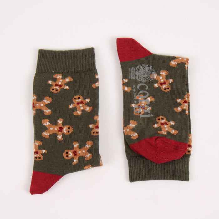 Pair of socks with gingerbread man pattern on a white background