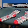 Pair of patterned socks on a factory table