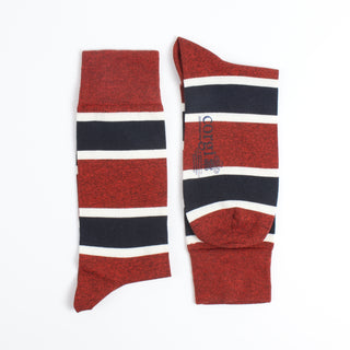 Red, white, and blue striped socks on a white background
