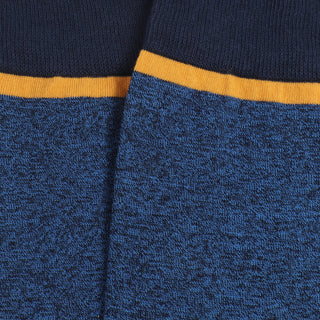 Close-up of blue socks with a yellow trim