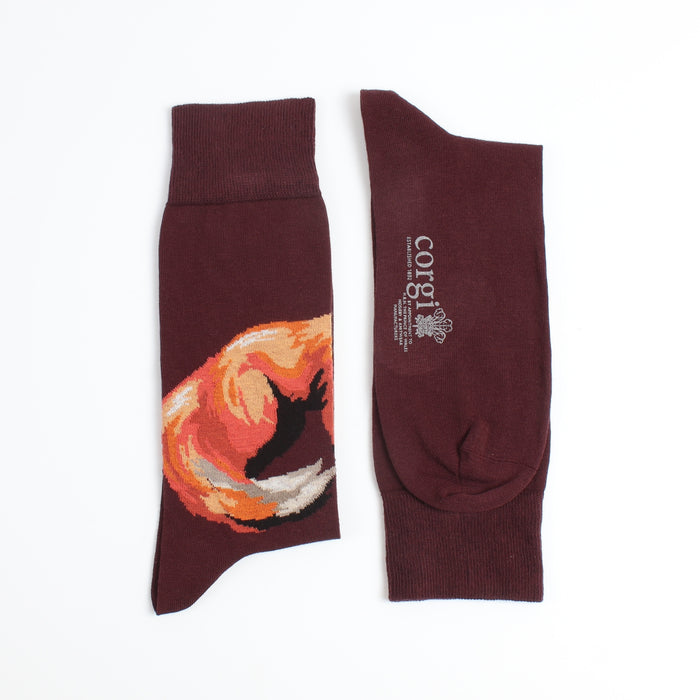 Maroon socks with a fox design on one and 'corgi' branding on the other, on a white background.