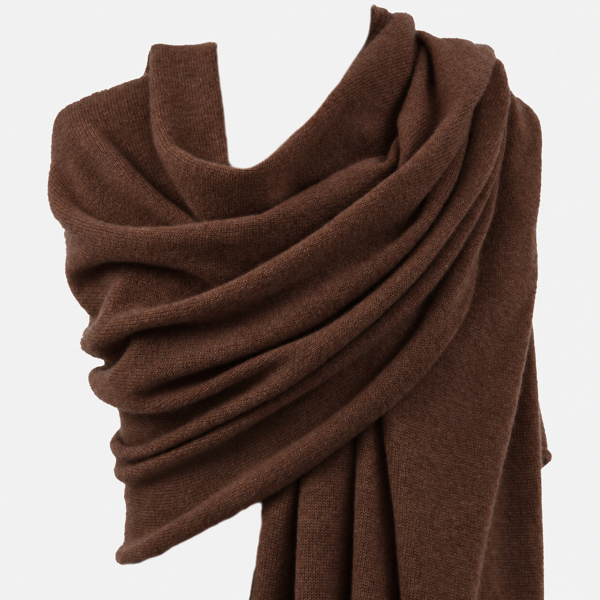 A draped brown knit scarf wrapped around a mannequin torso against a clean white background.