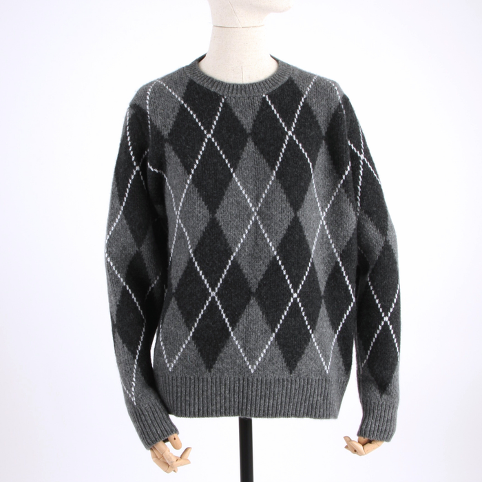 Gray argyle sweater on a mannequin against a white background