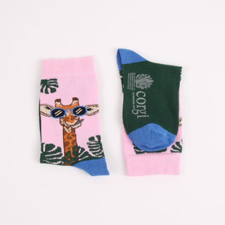 Colourful socks with a giraffe design on a pink background