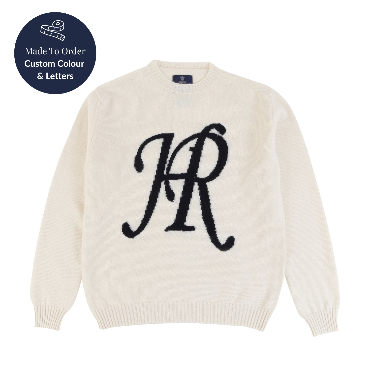 White sweater with black initials on a white background