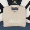 folded babies sweater