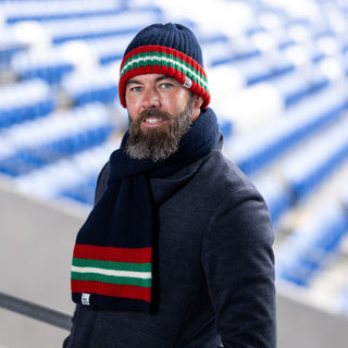 Joe Ledley wearing the Red Wall hat and scarf.