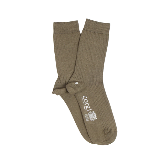Pair of green socks with a visible brand logo on a white background