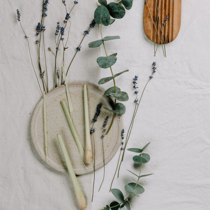 Herbs and flowers on a linen tablecloth.