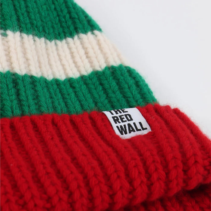 Knitted beanie with green, white, and red stripes and a visible brand label on a white background.