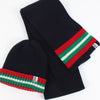 Hat and scarf laid flat on a white background.