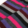 Close-up of multicolored striped fabric with pink, purple, gray, and black.